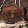 Handmade carved belt bag with a fleur-de-lys design