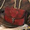 Handmade carved belt bag with a fleur-de-lys design