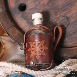 Small glass bottle with a Star of Chaos carved leather belt holder