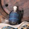 Small glass bottle with the One ring carved leather belt holder