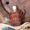 Small glass bottle with the One ring carved leather belt holder