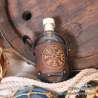 Small glass bottle with a Vegvisir carved leather belt holder