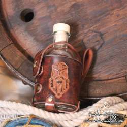 Small glass bottle with a  dwarf Long Beard carved leather belt holder