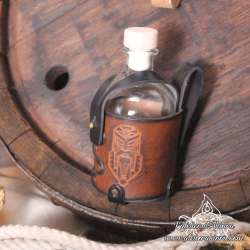 Small glass bottle with a  dwarf Long Beard carved leather belt holder