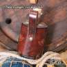 Big glass bottle with a One ring carved leather belt holder