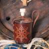 Big glass bottle with a Chaos star carved leather belt holder